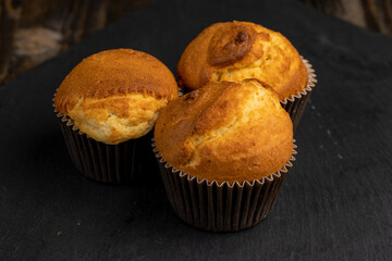 Soft and fresh fragrant wheat cupcake on a black stone