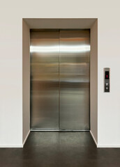 Shiny metal doors of a modern passenger elevator. Front view.