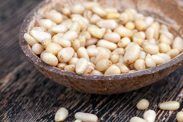 peeled pine nuts close-up on the table