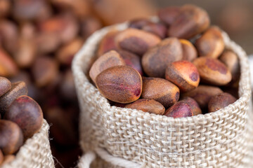 a bunch of pine nuts in the shell