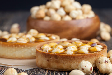 round tartlet with salted caramel and roasted hazelnuts