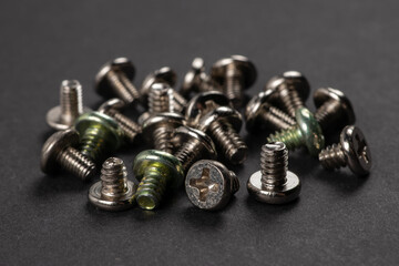 Screws. Silver steel self-tapping screws for background.