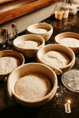 Vertical shot of the dough for bread put in the plates ready to be baked in the oven