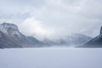 Fototapeta na wymiar Aerial view of beautiful mountains in winter in Alberta, Canada