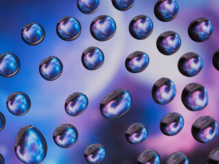 Water drops on the texture of a colored background. the rear window is covered with water droplets....