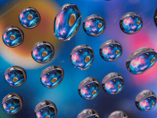 Water drops on the texture of a colored background. the rear window is covered with water droplets. bubbles in the water