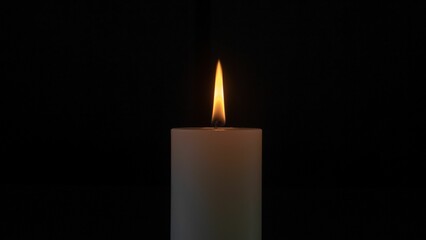 Fototapeta na wymiar Closeup shot of a romantic candle against the black background