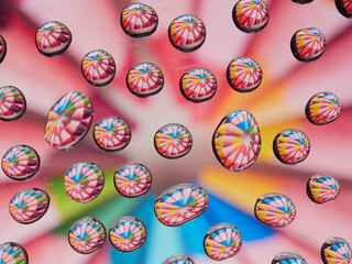 Water drops on the texture of a colored background. the rear window is covered with water droplets. bubbles in the water