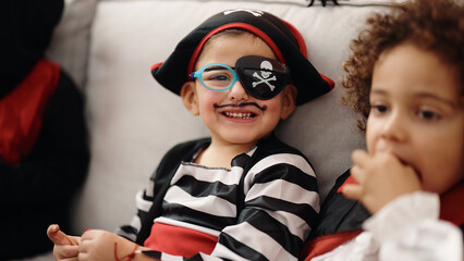 Adorable boys having halloween party smiling confident at home