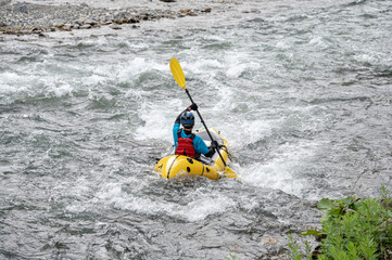 Fototapeta na wymiar packraft downriver kayak paddlesports