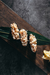 isolated sushi and rolls on a dark contrasting background, menu format

