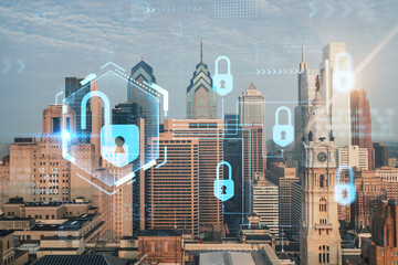 Aerial panoramic cityscape of Philadelphia financial downtown, Pennsylvania, USA. City Hall Clock Tower, sunrise. Padlock hologram. The concept of cyber security to protect confidential information