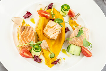 Smoked salmon on stone table in fine dining restaurant