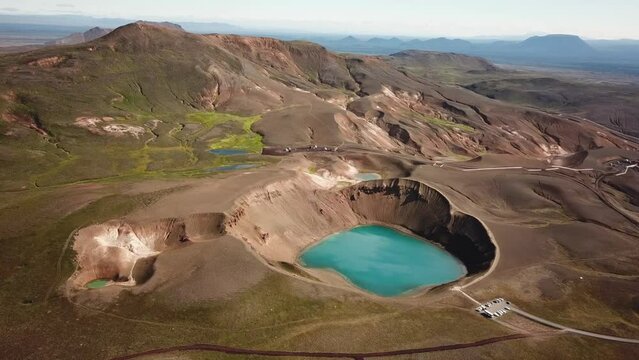 4K cinematic Aerial drone footage of Viti crater at summer. Geothermal lake with turquoise water and Oskjuvatn lake in Askja caldera, near Hverir Myvatn geothermal area, Iceland. High quality footage
