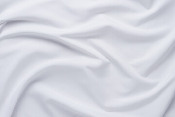 White fabric. luxurious white fabric texture background. Creases of satin, silk and cotton.