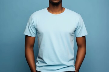 Black man model wearing a plain light blue short sleeved t-shirt, isolated on a blank background. Mock-up, torso only. Generative AI illustration.