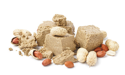 Pieces of sweet halva with peanuts on white background