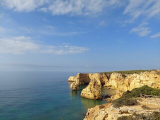 Fototapeta na wymiar View on the dramatic cliffs of the coast of Algarve in Portugal