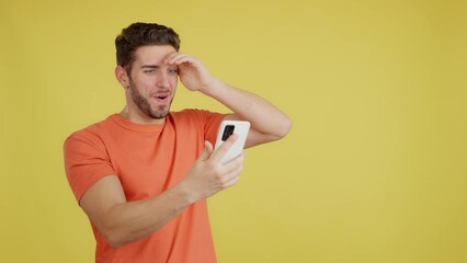 Surprised man looking the screen of a mobile