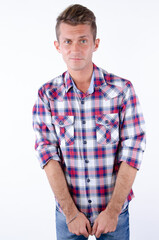 Obraz premium Young attractive man posing in the studio. White background.