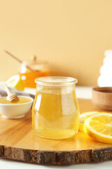 Jar of sweet honey on table