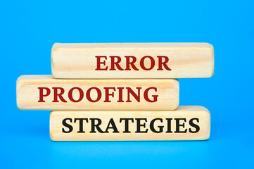 Error proofing strategies text on wooden blocks. Business culture and Operational excellence concept