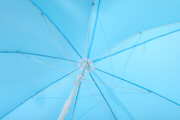 Blue beach umbrella as background