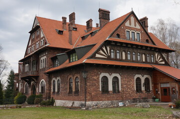 People's House (Dom Ludowy) built in 1902-1903,  building was erected in accordance with national Zakopane style in Ostrowy Gornicze district. Sosnowiec, Poland. - obrazy, fototapety, plakaty