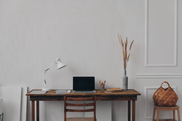 No people shot of creative home workplace with wooden desk and chair