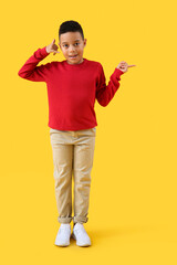 Little African-American boy showing 