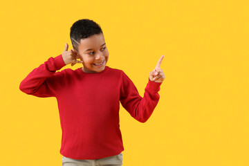 Little African-American boy showing 