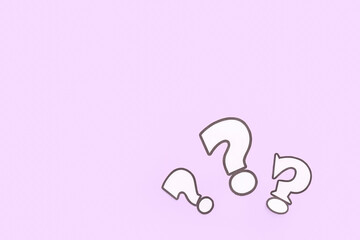 Paper question marks on lilac background
