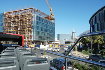 City center of Cape Town with modern building under construction from top of double decker hop on...