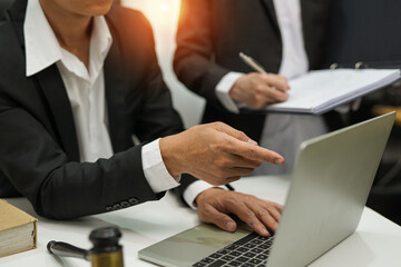 Fototapeta premium judge on wooden table And experienced lawyers meet with clients and give advice behind the scenes. legal services legal consulting concept