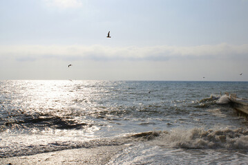 Sunset over the sea, sun glare on the water, background