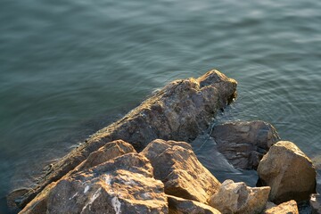 Fototapeta na wymiar Rocks in serene water