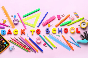 Frame made of colorful stationery supplies and text BACK TO SCHOOL on pink background
