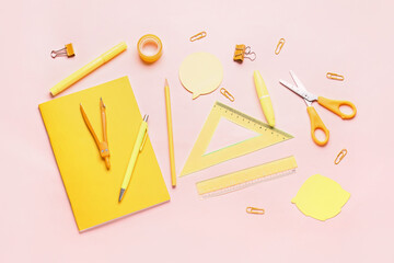 Stationery supplies on pink background