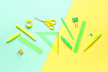 Stationery supplies on color background