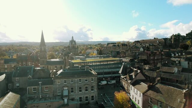 High-angle view of the Stirling castle on the top of the mountain covered by trees in Scotland.