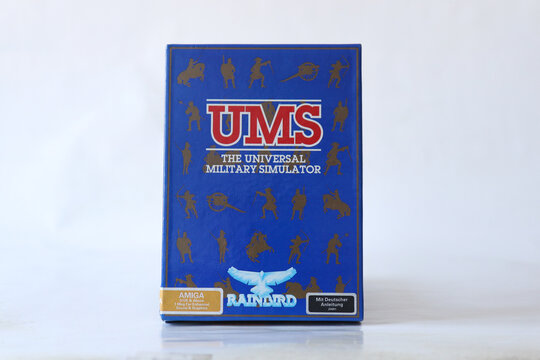 BERLIN - FEBRUARY 12, 2022: Vintage Retro Video Game UMS - THE UNIVERSAL MILITARY SIMULATOR for the Commodore Amiga on Floppy Disks. Rainbird released this Strategy War Game in 1987. Front side of box