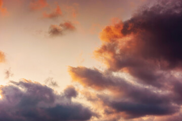 evening sky in orange glow. huge fluffy clouds. dramatic natural background