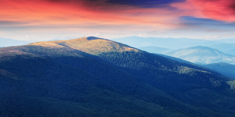 nature scenery with mountains and valleys. landscape background with forested rolling hills in summer