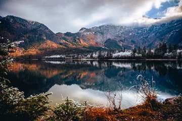 Keuken foto achterwand Reflectie Landscape scene of reflecting Lake Bohinj with trees and mountains at sunset in Slovenia