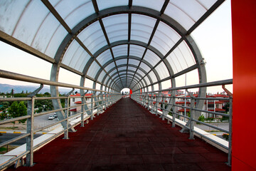 Pedestrian walkway in the city, metal structure of the ceiling in a walkway
