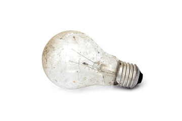 Old and dusty light incandescent bulb isolated on white background.