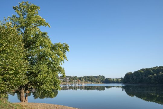 Bever lake, close to Huckeswagen on an early morning during autumn, Bergisches Land, Germany