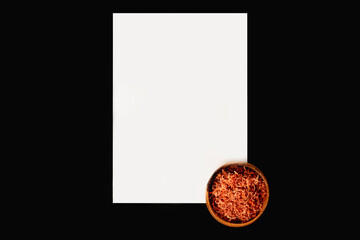 Dried carrots with white sheet of paper for cooking. Vegetable drying in dehydrator. Healthy and healthy food.