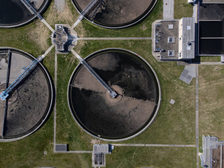Circular tanks of water treatment facility for gray water recycling.