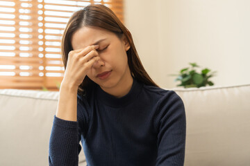 Burnout, weary asian young woman, girl have eyestrain, dizzy, hand touch nose, expression to face...